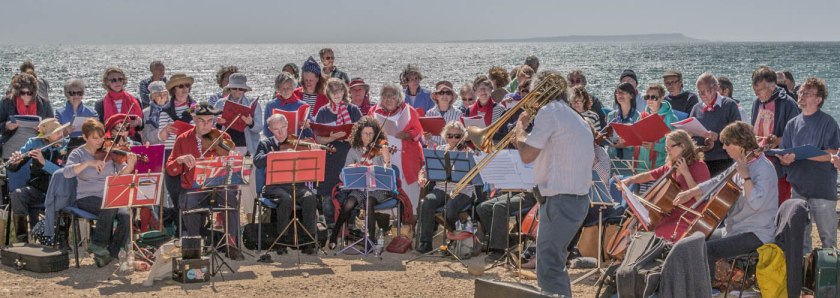 Group of musicians and singers on a beach