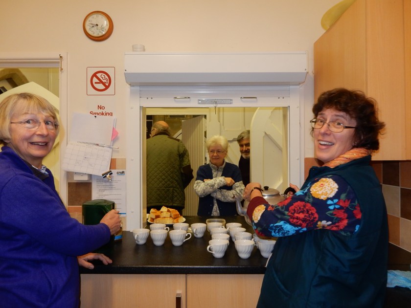 Two ladies serving tea
