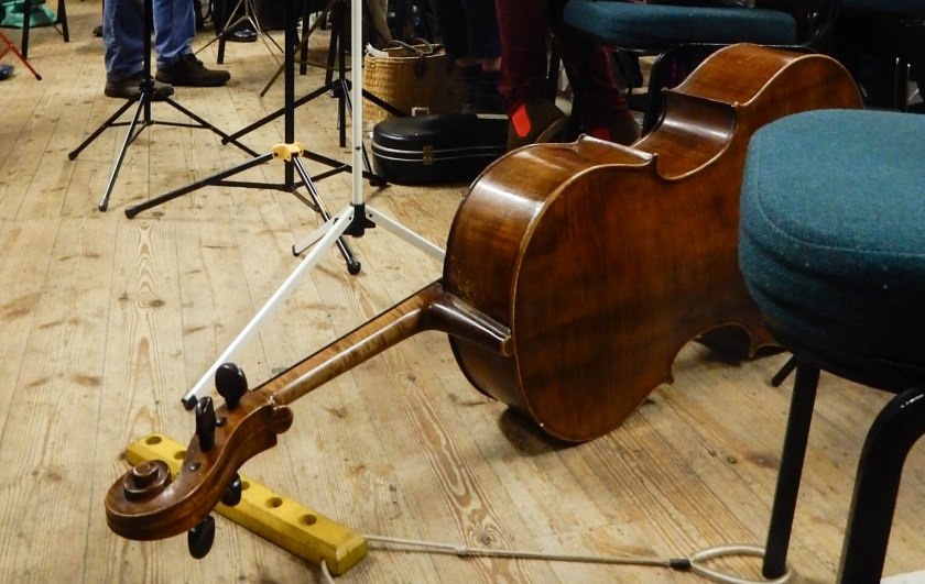 Cello on its side on the floor