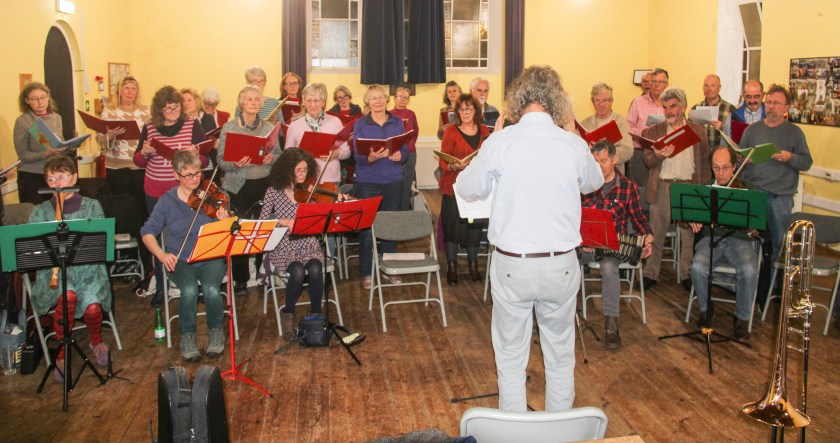 Singers and Band rehearsing