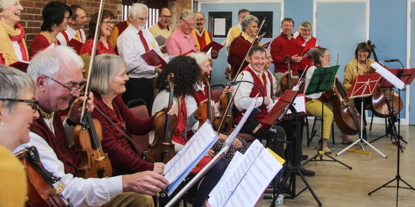 Band and singers in rehearsal