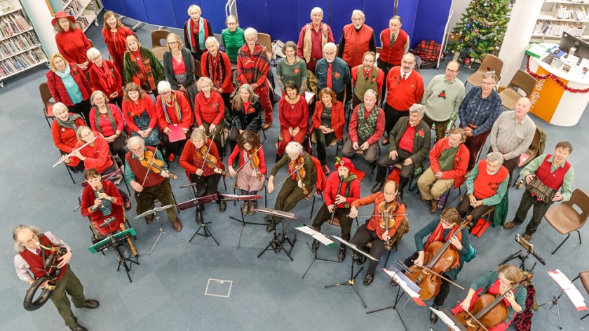 Large group of men and women, looking up at the camera